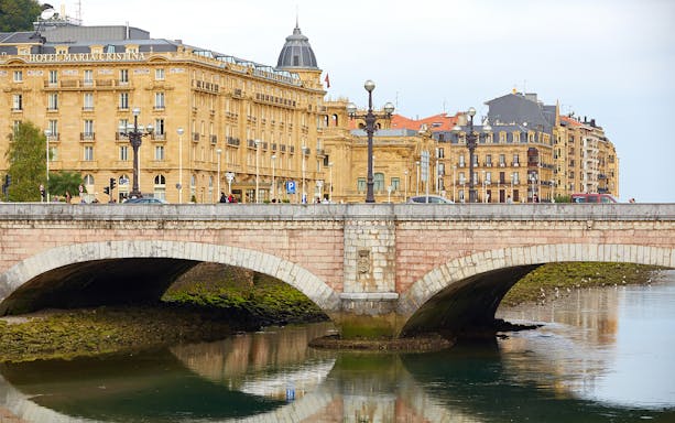 San Sebastian bridge and historic buildings on a guided walking tour.