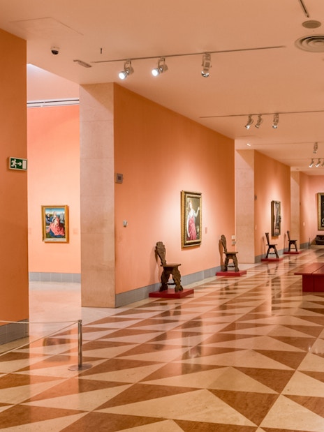 Thyssen Bornemisza Museum gallery room with paintings on display in Madrid.