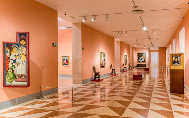Thyssen Bornemisza Museum gallery room with paintings on display in Madrid.