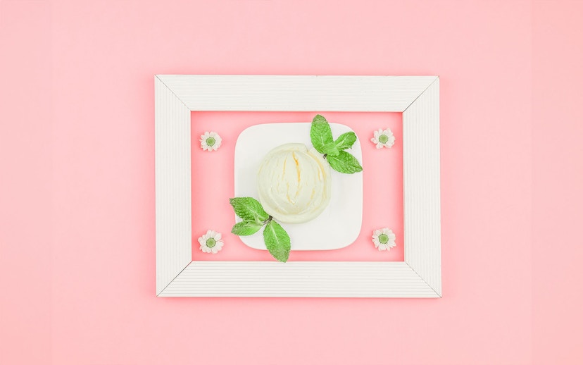 Ice cream scoop with mint leaves on a plate at Singapore's Museum of Ice Cream.