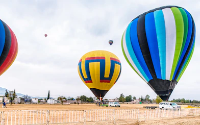 Hot air balloons being prepared for flight at Teotihuacan, Mexico.