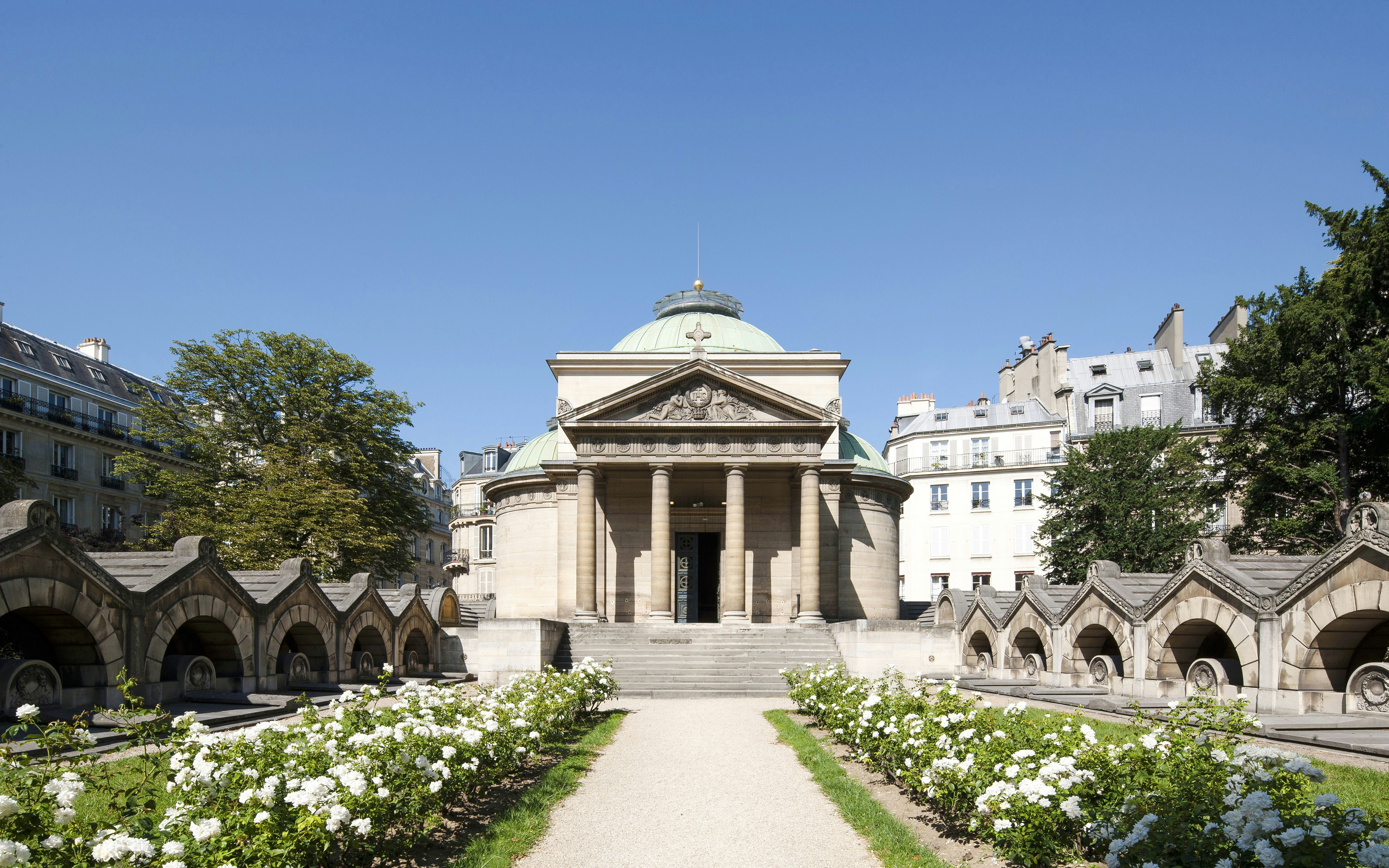 Expiatory Chapel in Paris with surrounding gardens and historic architecture.