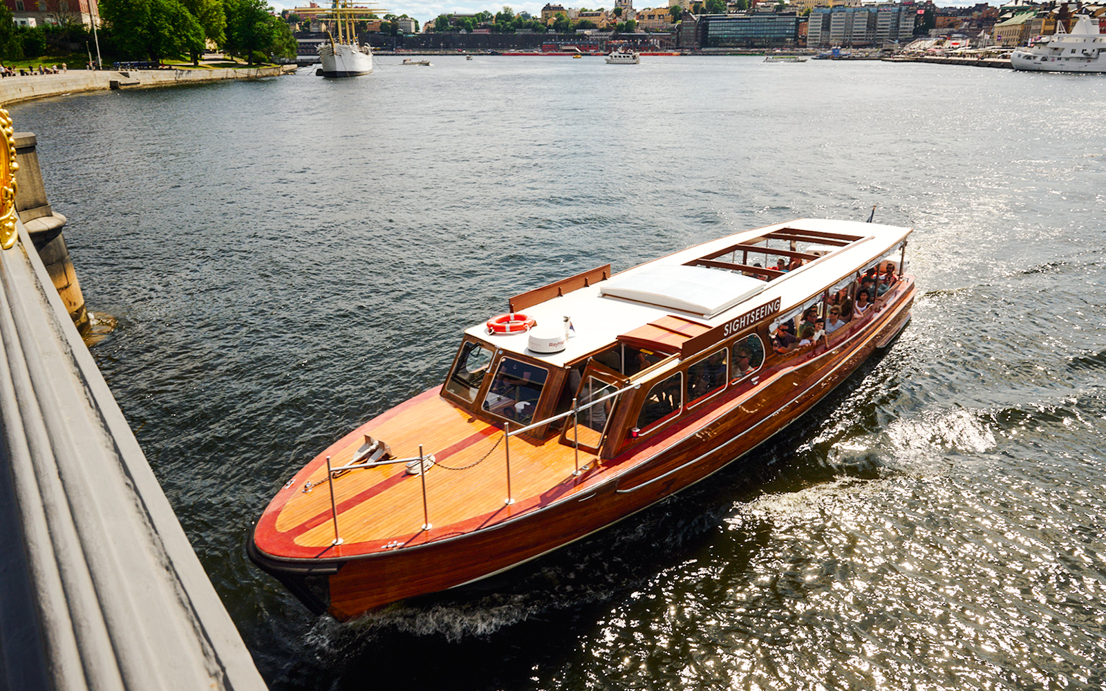 Classic wooden boat touring Stockholm Archipelago.