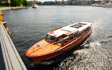 Classic wooden boat touring Stockholm Archipelago.