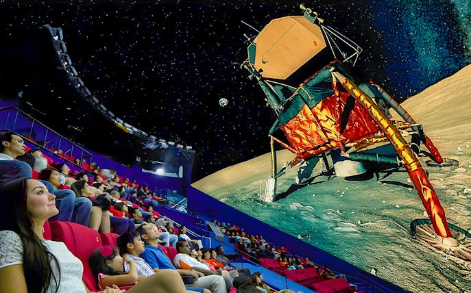 Visitors watching a space-themed show at a planetarium, Science Centre.