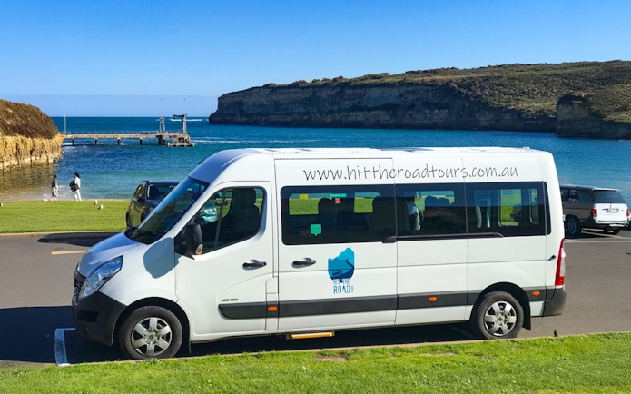 Van parked by the ocean on Great Ocean Road Reverse Tour.