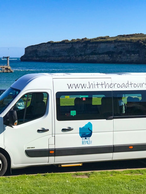Van parked by the ocean on Great Ocean Road Reverse Tour.