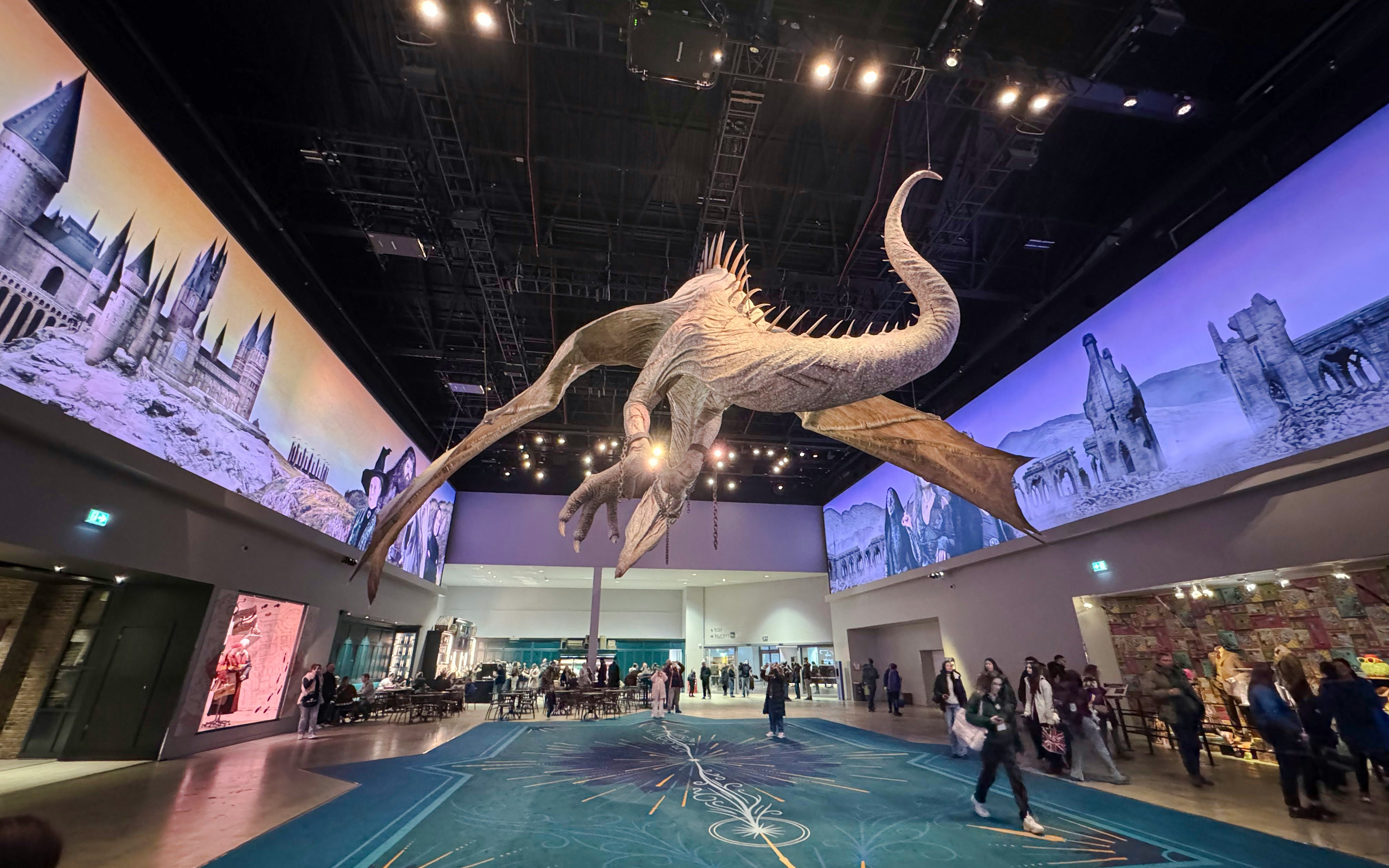 Suspended dragon model at Gringotts Wizarding Bank exhibit, Harry Potter tour.