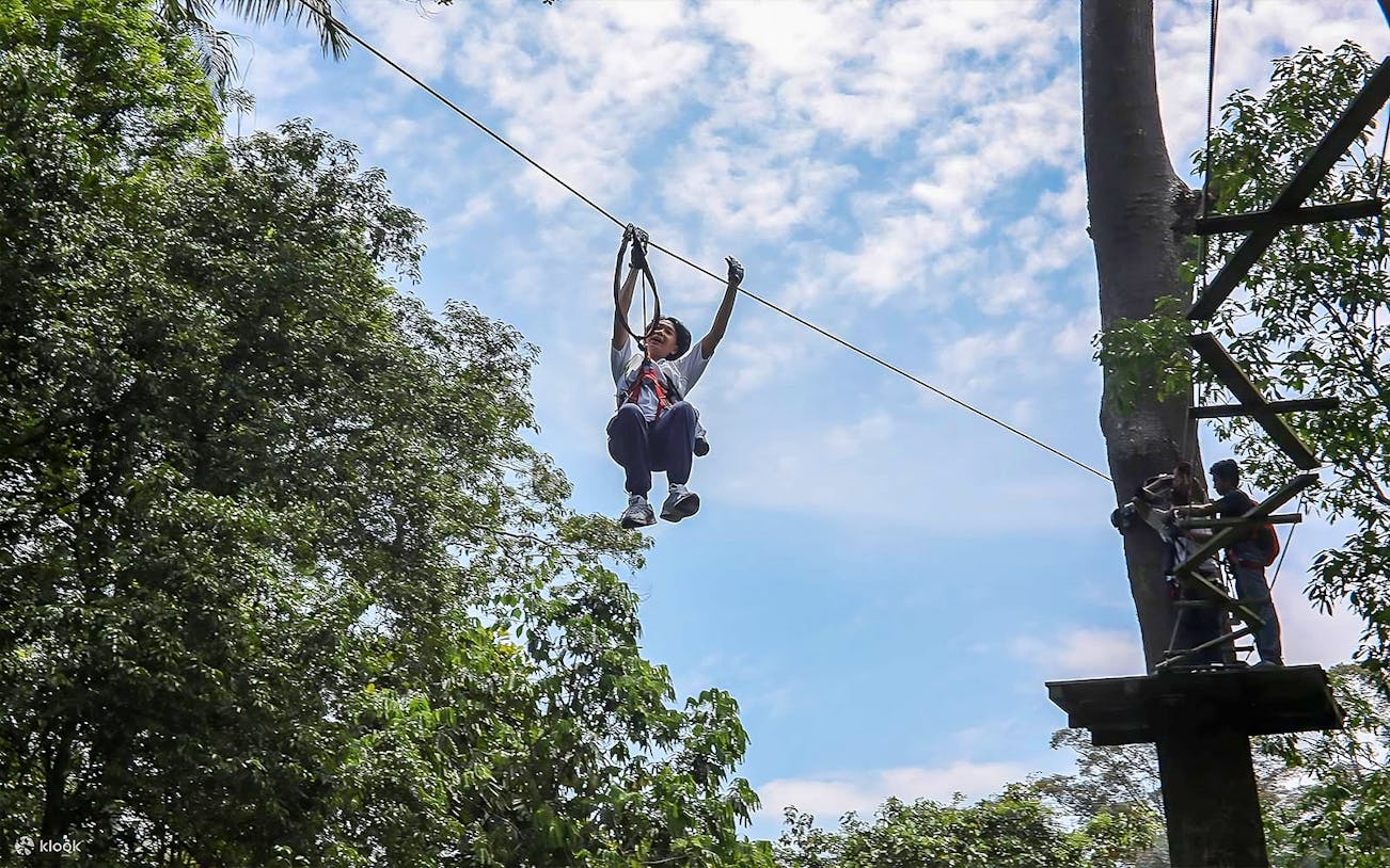 Person ziplining at SKYTREX Adventure Sungai Congkak, Kuala Lumpur.