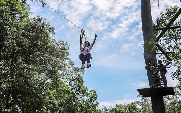 Person ziplining at SKYTREX Adventure Sungai Congkak, Kuala Lumpur.