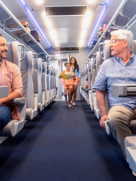 Passengers seated inside the Brightline train from Miami to Orlando.