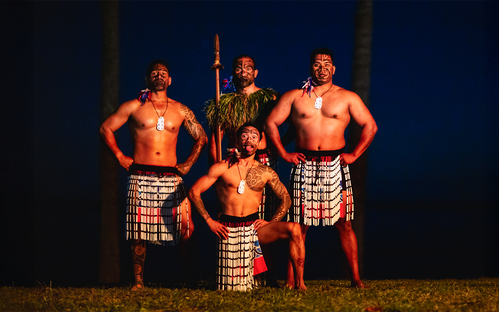 Performers in traditional attire at Moana Luau, Hawaii.