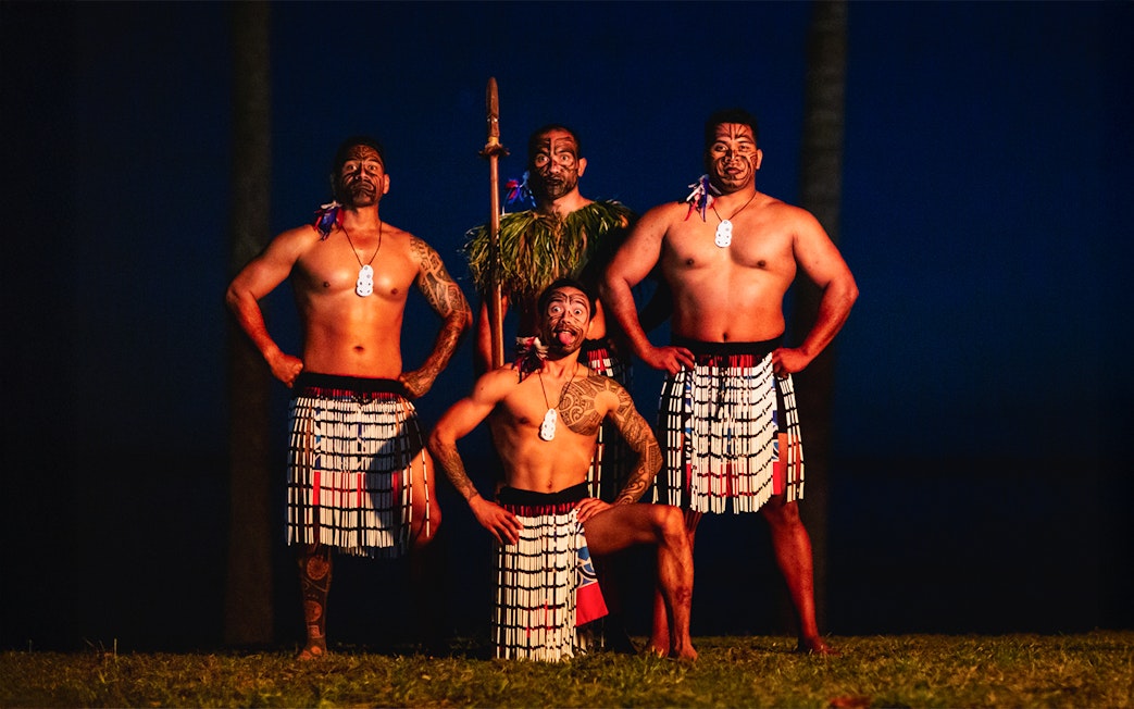 Performers in traditional attire at Moana Luau, Hawaii.