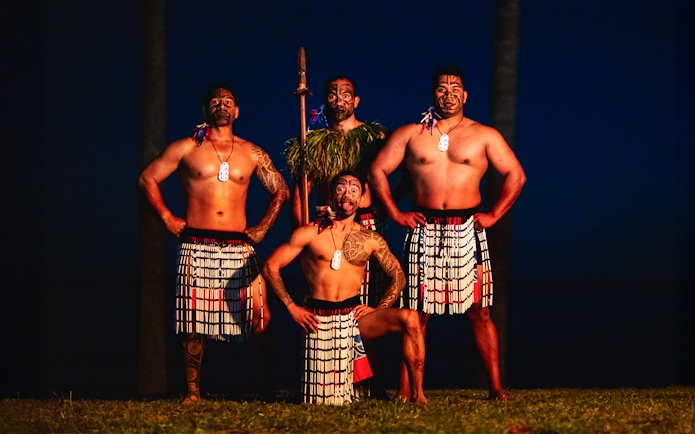 Performers in traditional attire at Moana Luau, Hawaii.