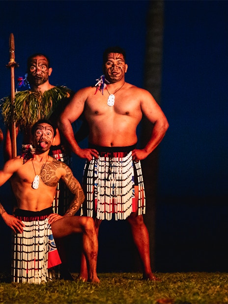 Performers in traditional attire at Moana Luau, Hawaii.