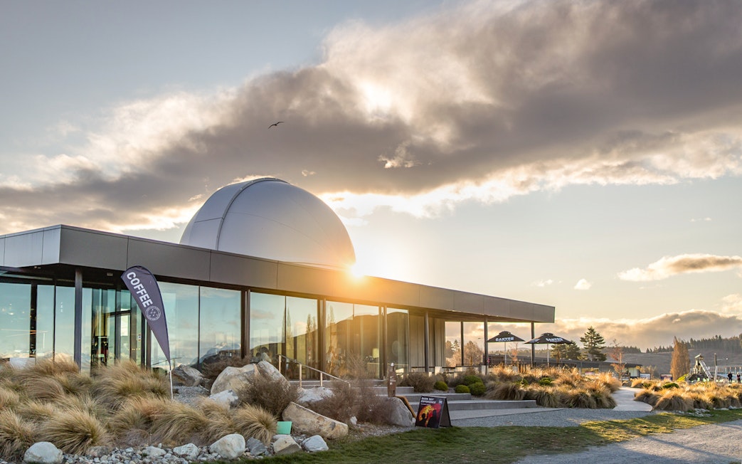 Exterior view of Dark Sky Indoor Cultural Astronomy Experience at sunset.