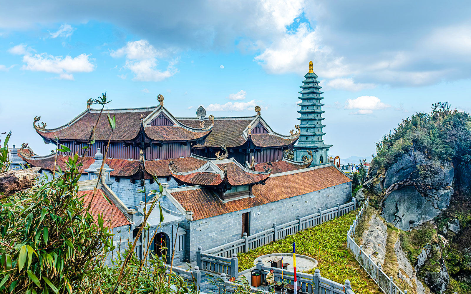 Fansipan Kim Son Bao Thang Pagoda with ornate roof and stone tower in Vietnam.