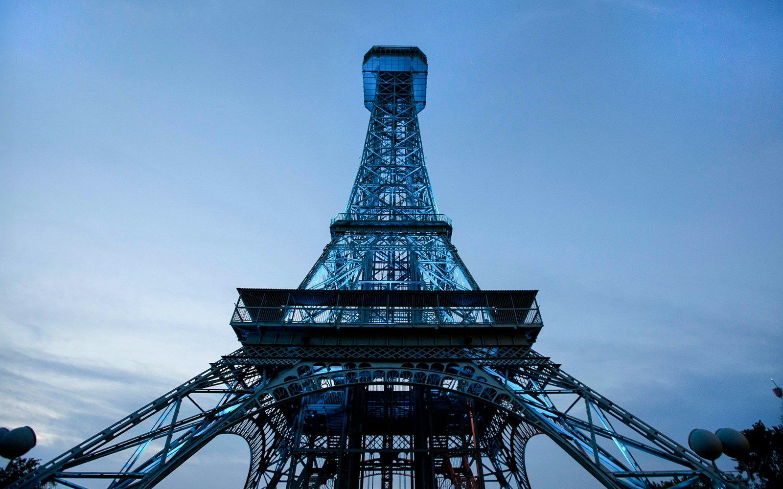 Replica of the Eiffel Tower at King's Island, Six Flags, against a twilight sky.