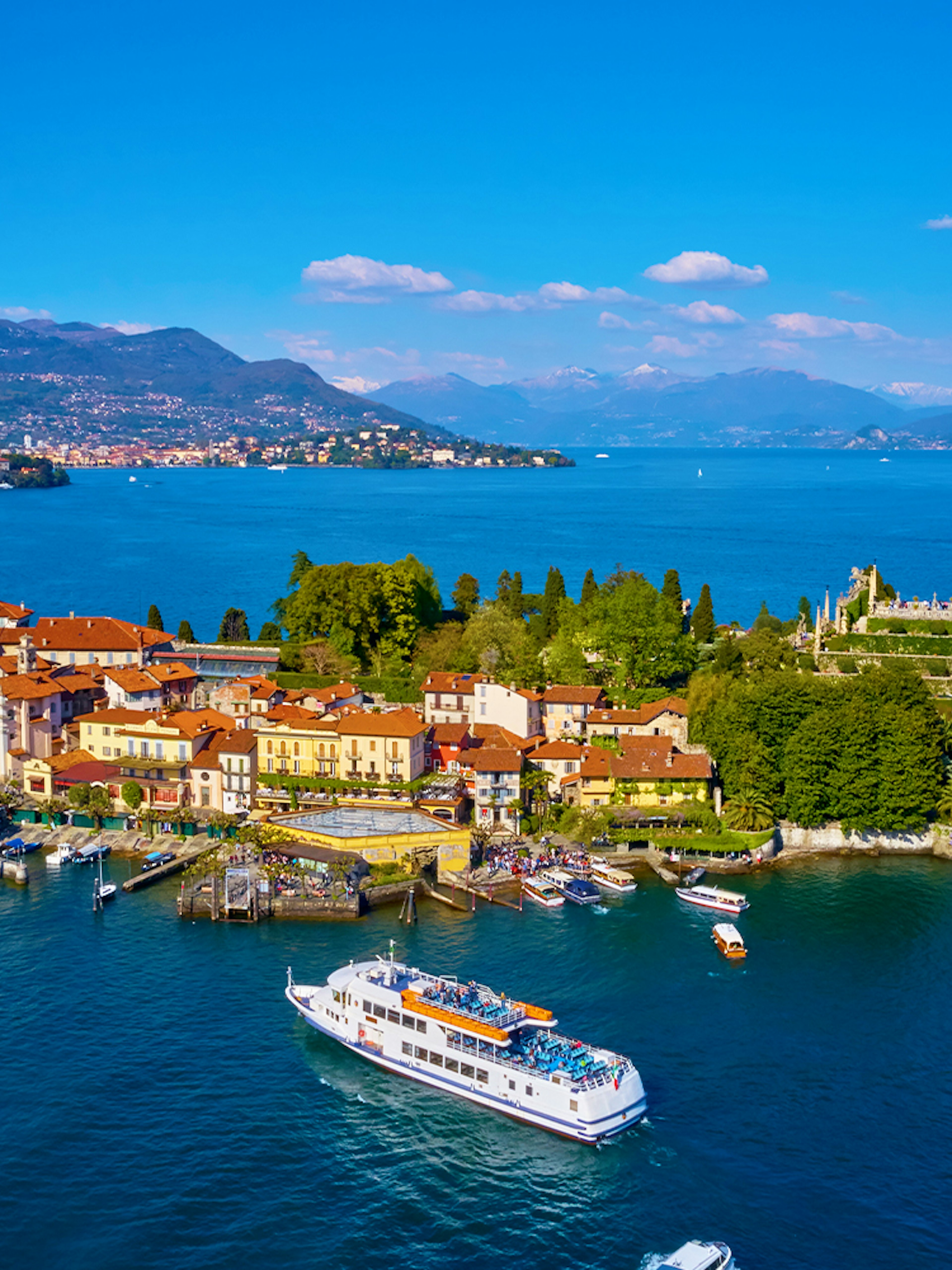 Isola Bella with ferry approaching, surrounded by Lake Maggiore, Italy.