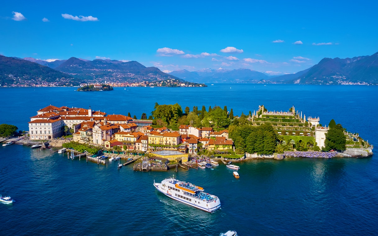 Isola Bella with ferry approaching, surrounded by Lake Maggiore, Italy.