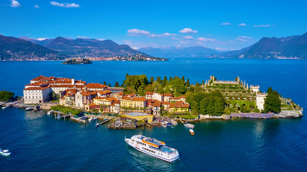 Isola Bella with ferry approaching, surrounded by Lake Maggiore, Italy.