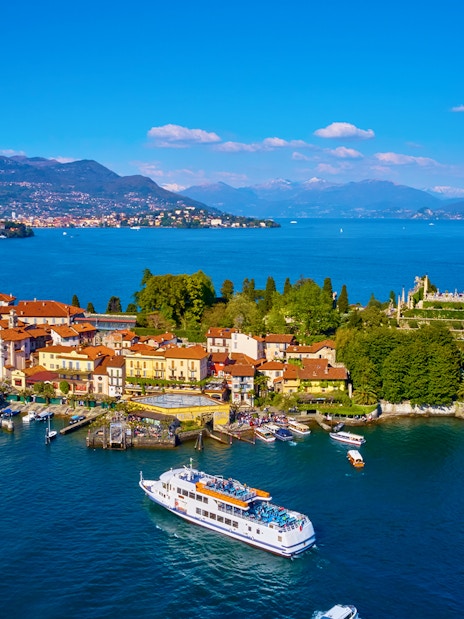 Isola Bella with ferry approaching, surrounded by Lake Maggiore, Italy.