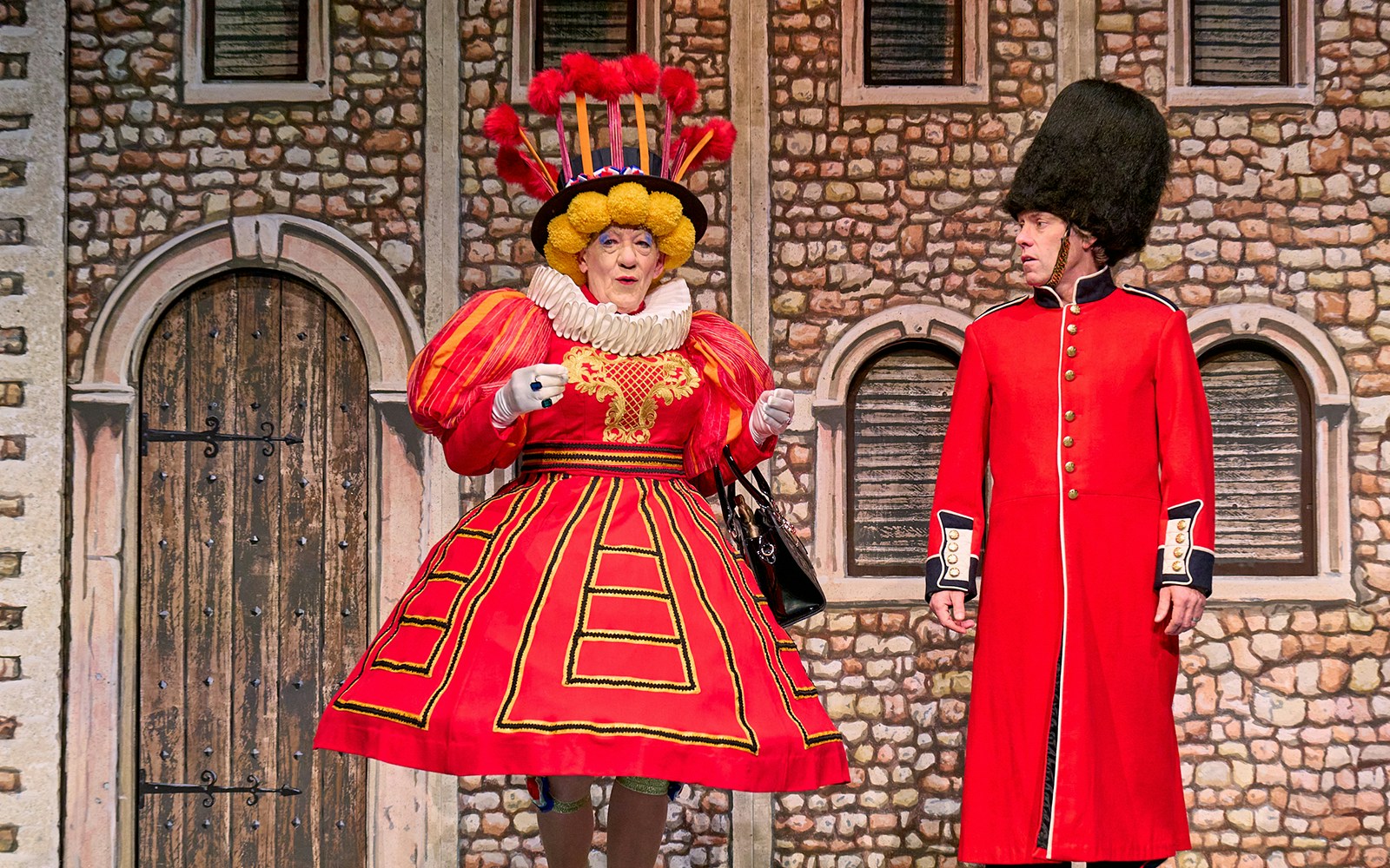 Mother Goose play at London theater with actors in costume on stage.