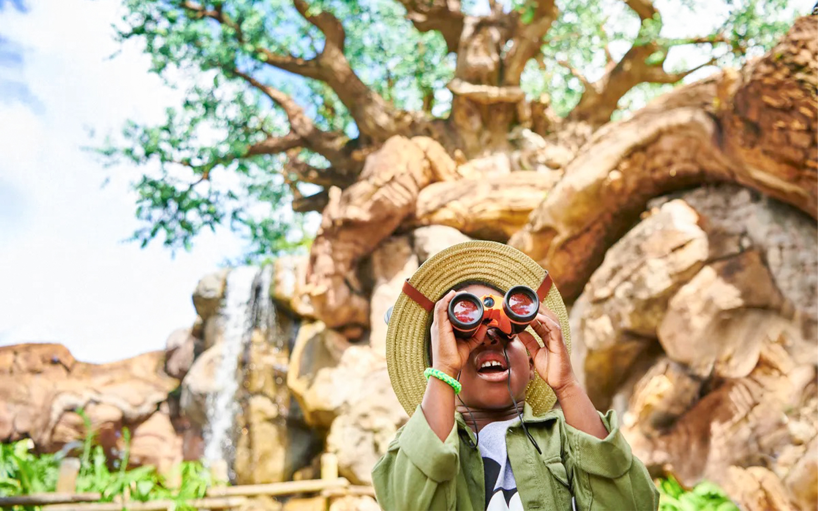 Child using binoculars at Animal Kingdom Theme Park, Walt Disney World, Orlando.