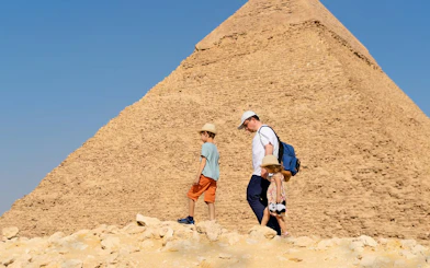 Family exploring pyramids on Cairo day trip from Hurghada.