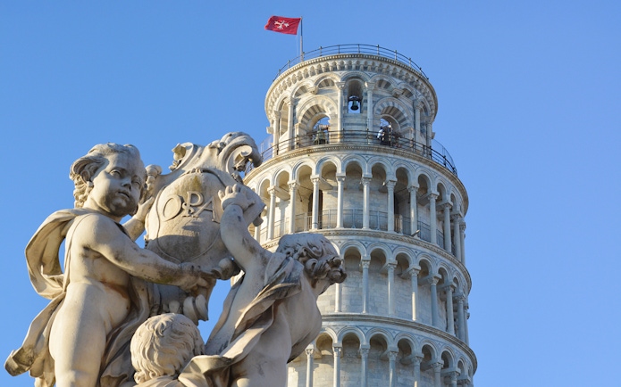 Fountain of the Putti with Leaning Tower of Pisa in background, Pisa, Italy.