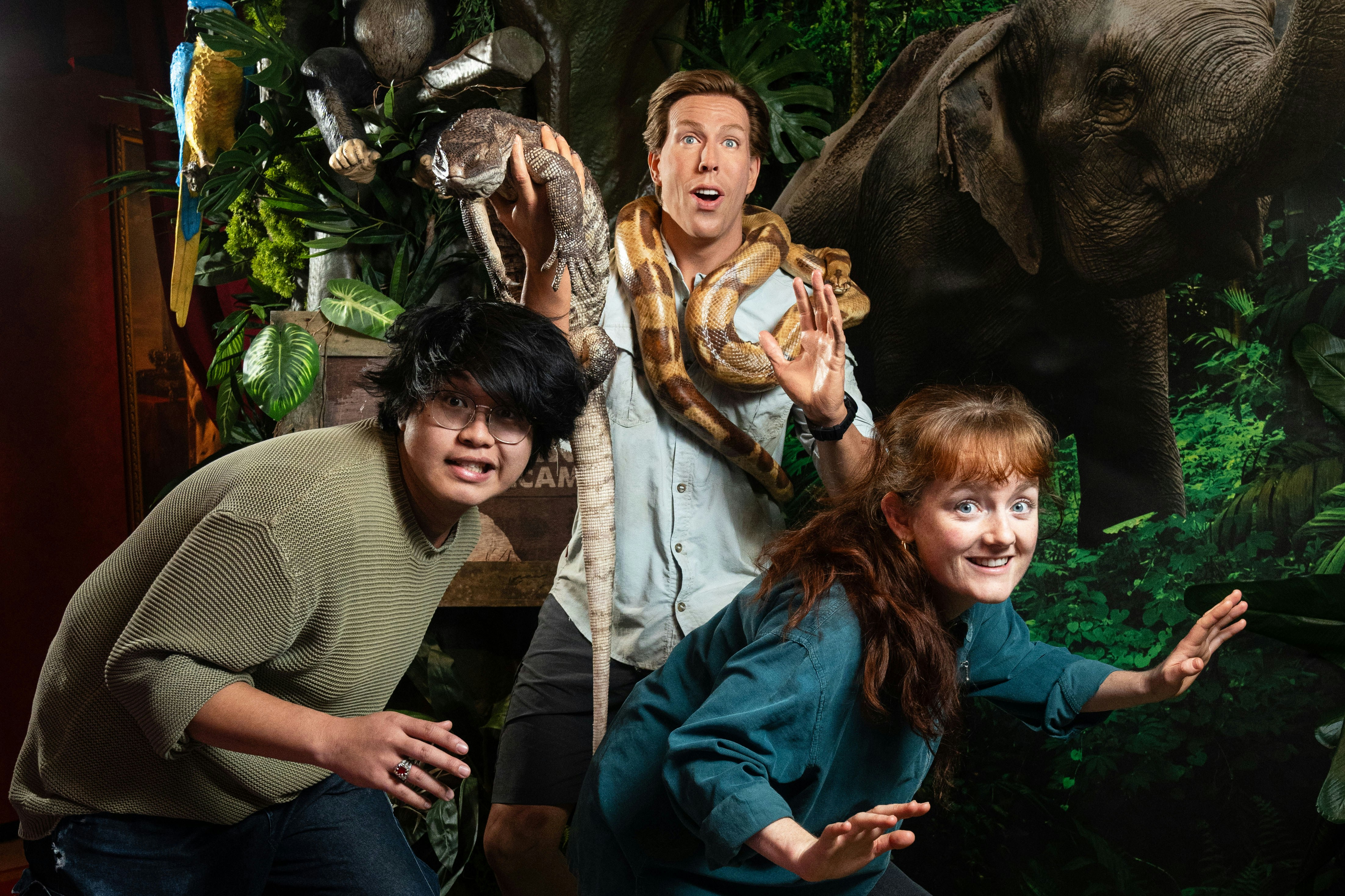 Visitors posing with jungle animals at Madame Tussauds Amsterdam.