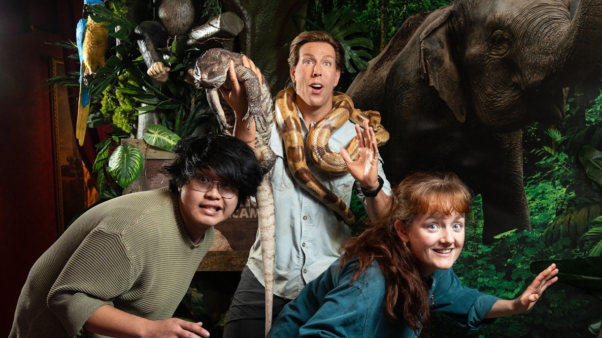 Visitors posing with jungle animals at Madame Tussauds Amsterdam.