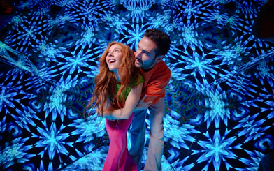 Guests enjoying kaleidoscopic room at Paradox Museum London.
