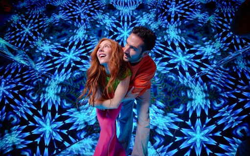 Guests enjoying kaleidoscopic room at Paradox Museum London.