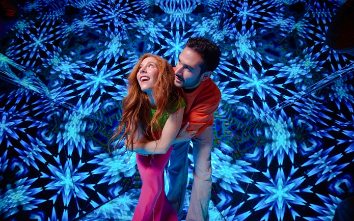 Guests enjoying kaleidoscopic room at Paradox Museum London.