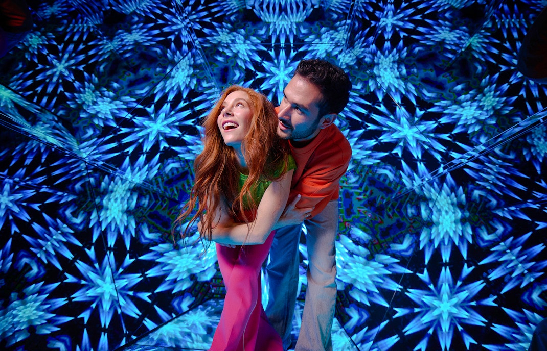 Guests enjoying kaleidoscopic room at Paradox Museum London.