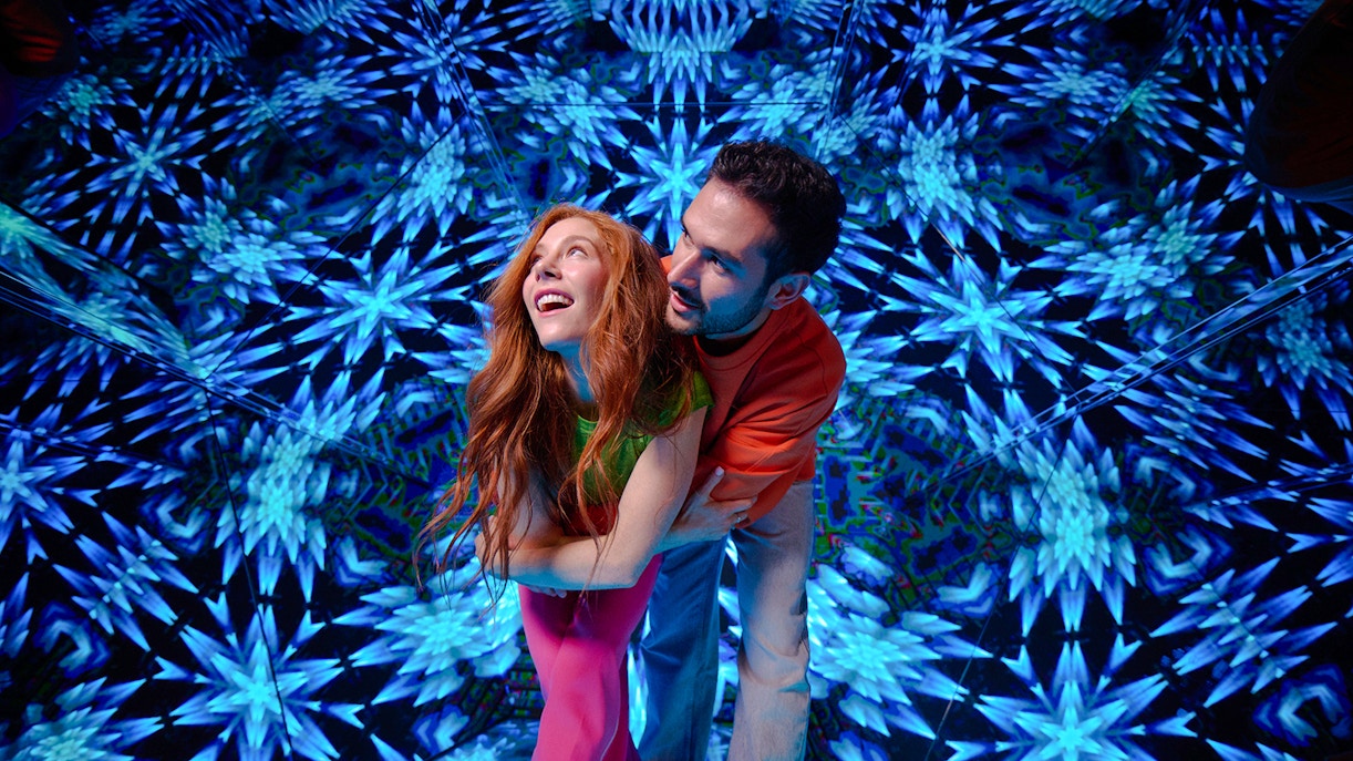 Guests enjoying kaleidoscopic room at Paradox Museum London.