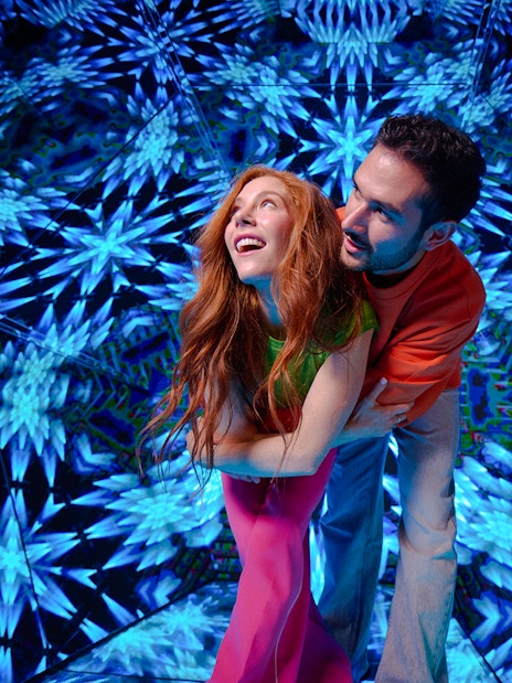 Guests enjoying kaleidoscopic room at Paradox Museum London.