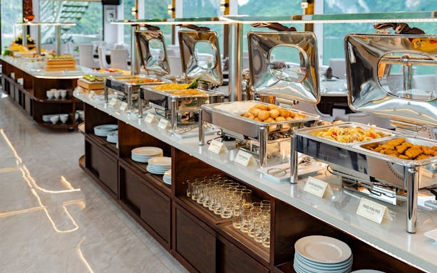 Buffet spread at Hercules premium with various dishes and serving trays.