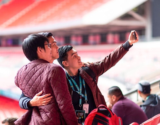 Visitors capturing memories inside Wembley Stadium in London.