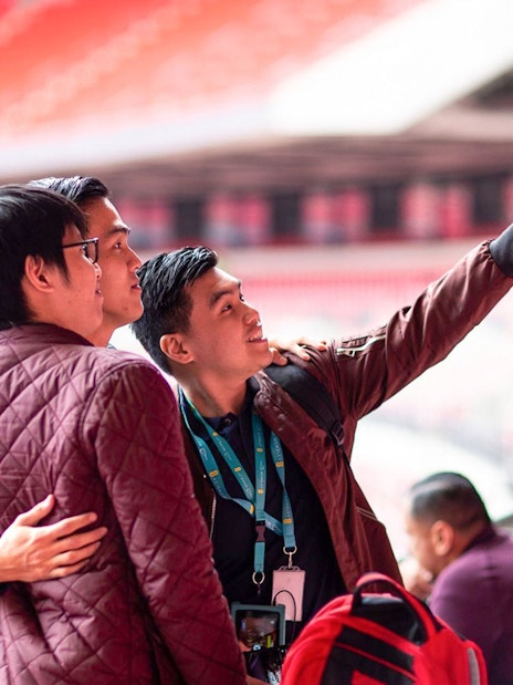 Visitors taking a selfie inside Wembley Stadium.