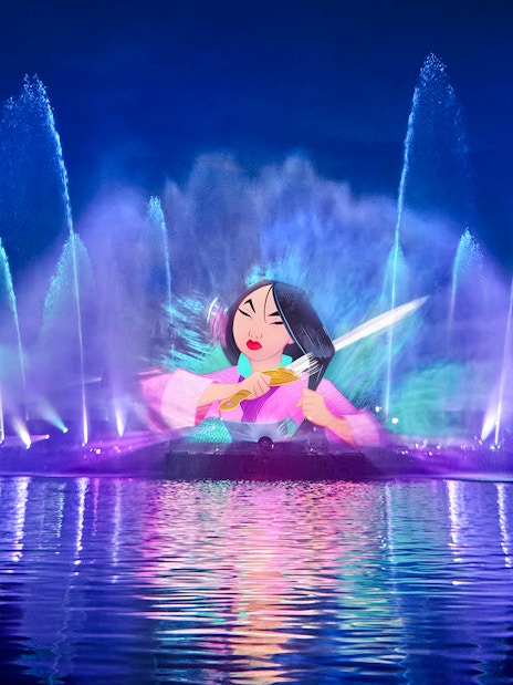 Disneyland World of Frozen Illuminations water show with character projection.