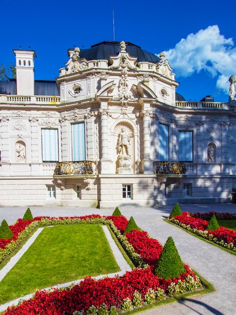 Linderhof Palace with ornate facade and manicured gardens, Germany.