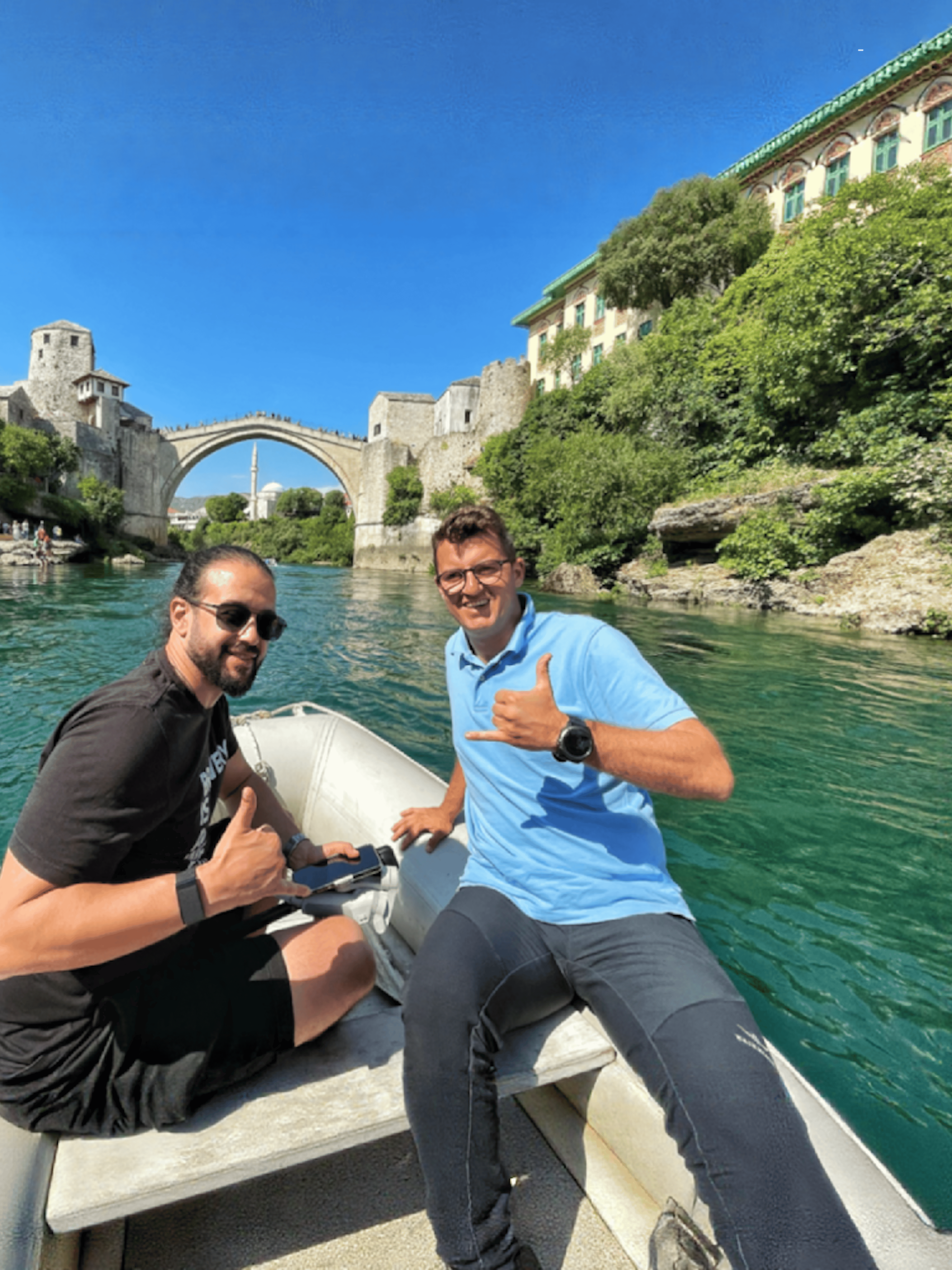 Guests on a boat near Mostar Bridge, Bosnia.