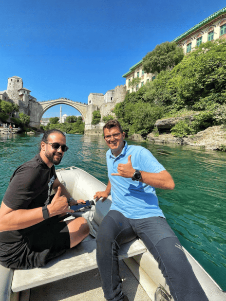 Guests on a boat near Mostar Bridge, Bosnia.