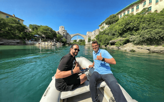 Guests on a boat near Mostar Bridge, Bosnia.