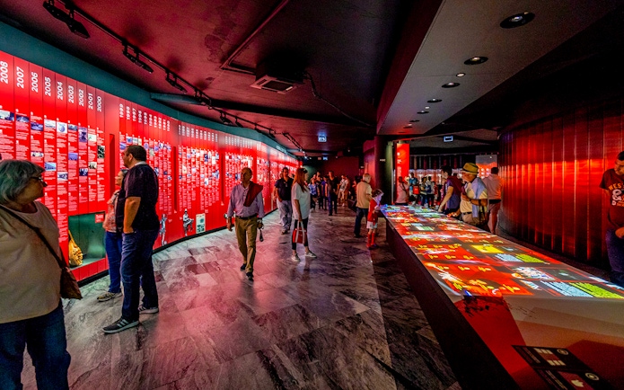 Visitors exploring exhibits at Benfica Stadium museum experience in Lisbon.