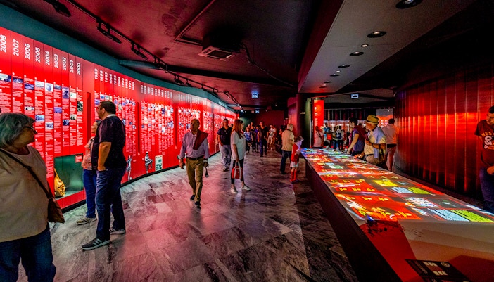 Visitors exploring exhibits at Benfica Stadium museum experience in Lisbon.