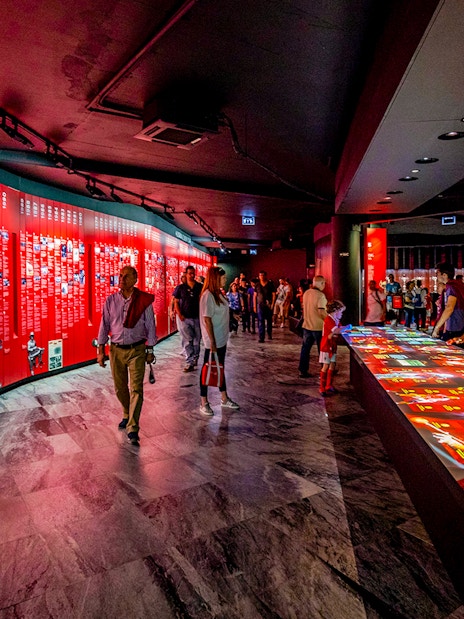 Visitors exploring exhibits at Benfica Stadium museum experience in Lisbon.
