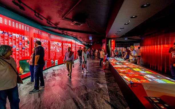 Visitors exploring exhibits at Benfica Stadium museum experience in Lisbon.